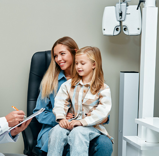 Mother and daughter at eye exam